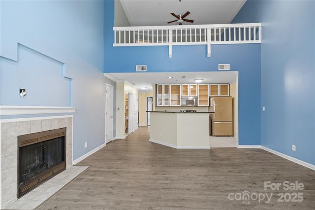 a view of a kitchen with a fireplace