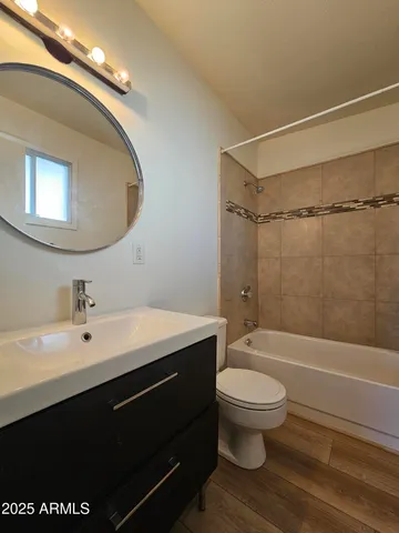 a kitchen with stainless steel appliances a refrigerator and microwave