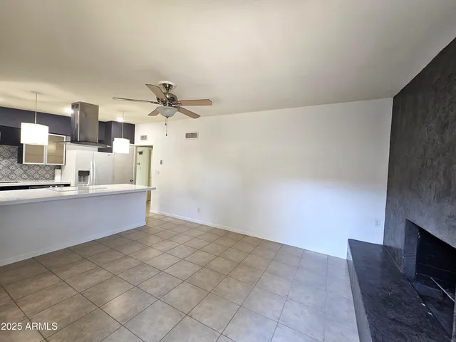 a view of a patio with table and chairs