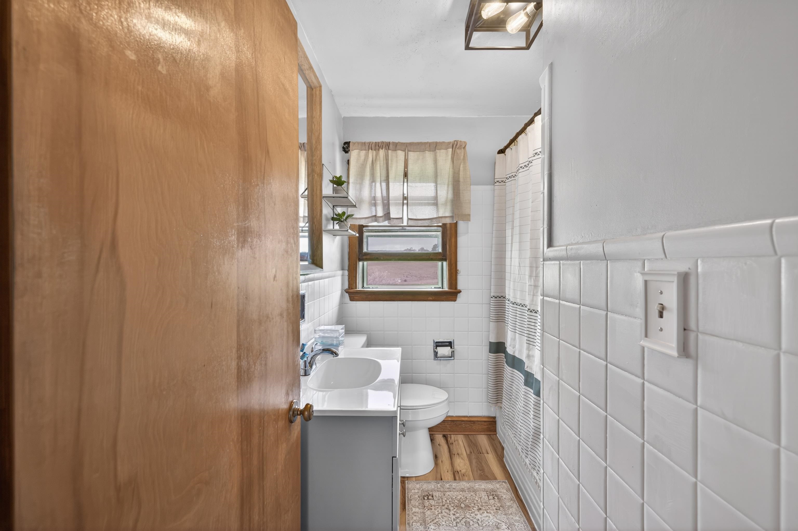 7827 Lee Highway Raphine, VA 24472 - Photo 30 of 62 a bathroom with a sink toilet and shower