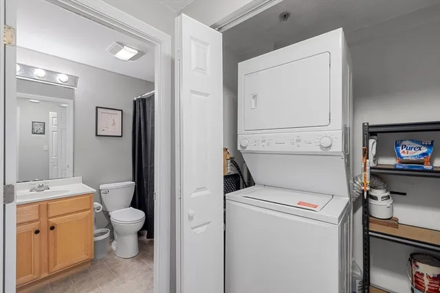 a view of bathroom with a toilet a sink and a mirror
