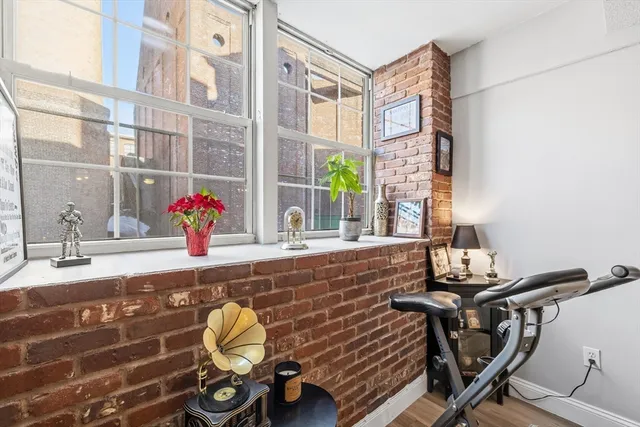 a view of a room with a table and chairs