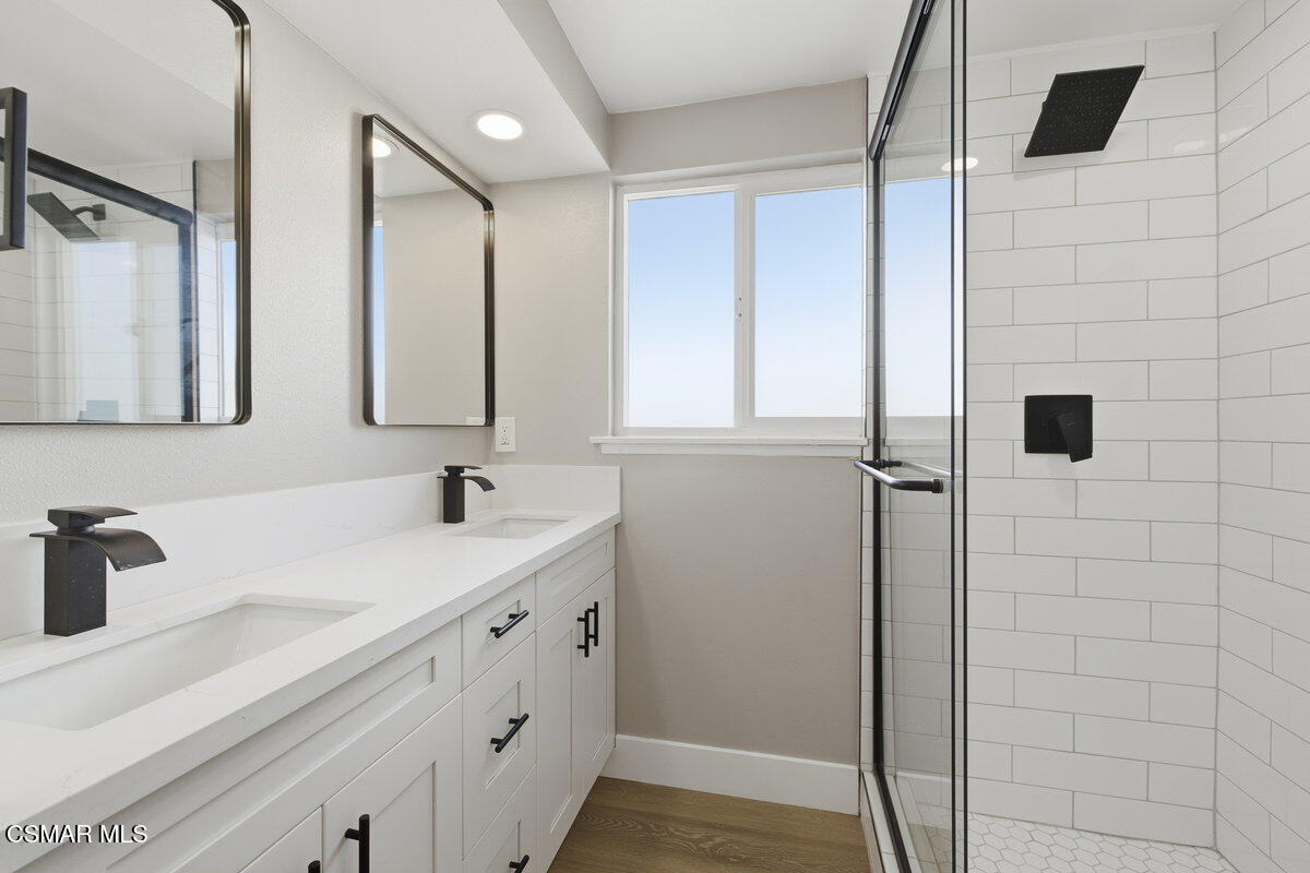 1069 Donner Avenue Simi Valley, CA 93065 - Photo 14 of 24 a bathroom with a sink and a mirror