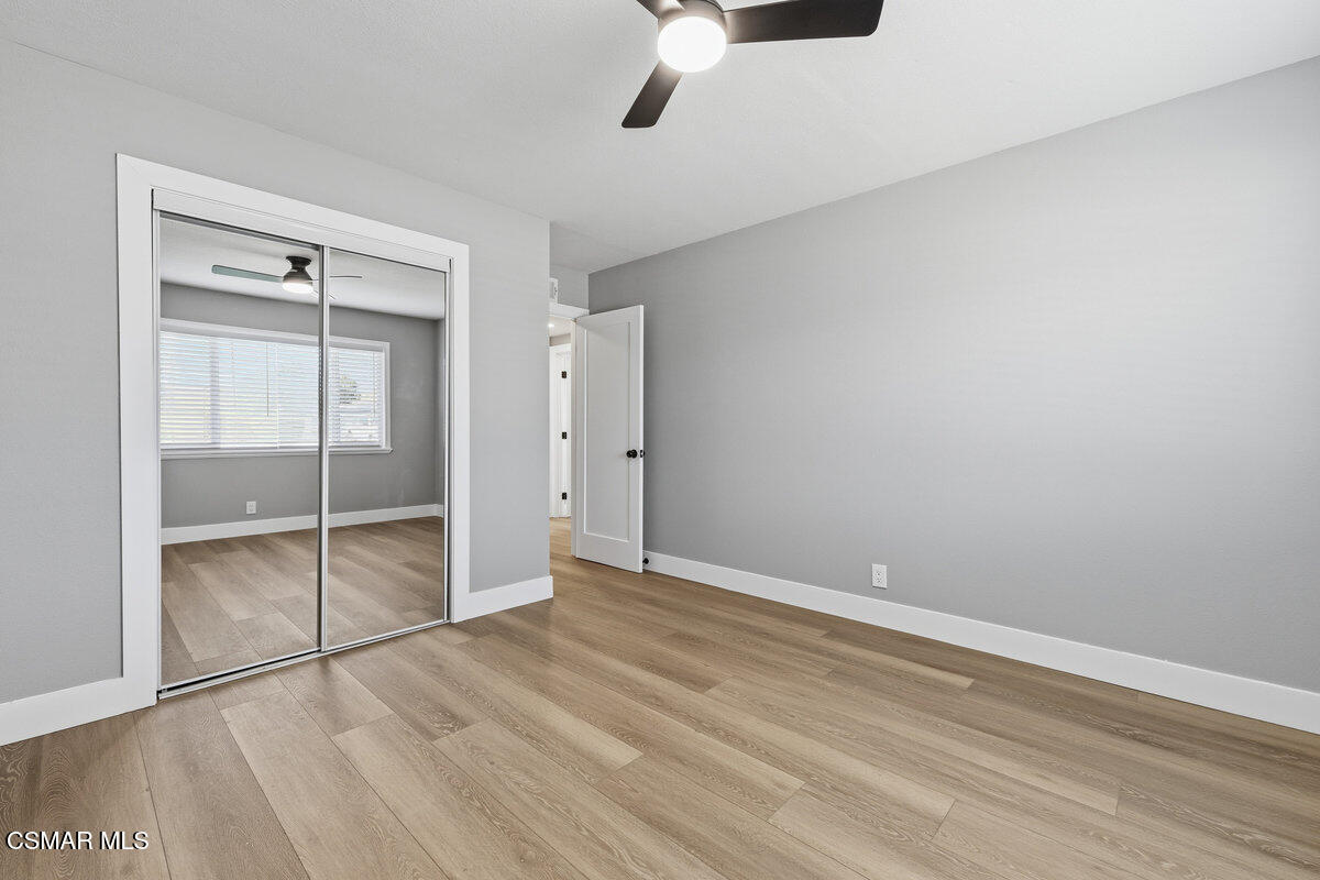 1069 Donner Avenue Simi Valley, CA 93065 - Photo 16 of 24 an empty room with wooden floor closet and windows