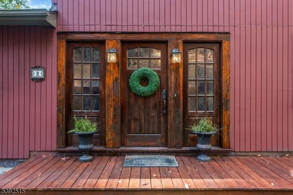 a view of an entryway with wooden floor and door