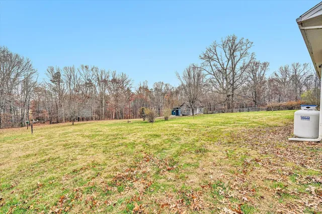 a view of a swimming pool with an outdoor space and seating area