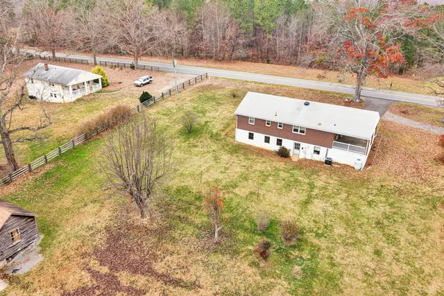 a view of a swimming pool with an outdoor space and seating area