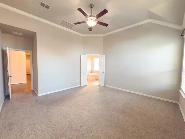 a spacious bathroom with a bathtub sink and mirror