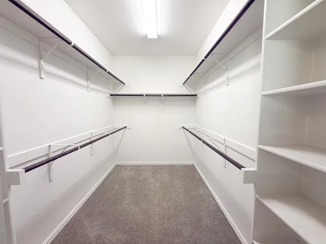 a bathroom with a bathtub a sink a vanity and a shower