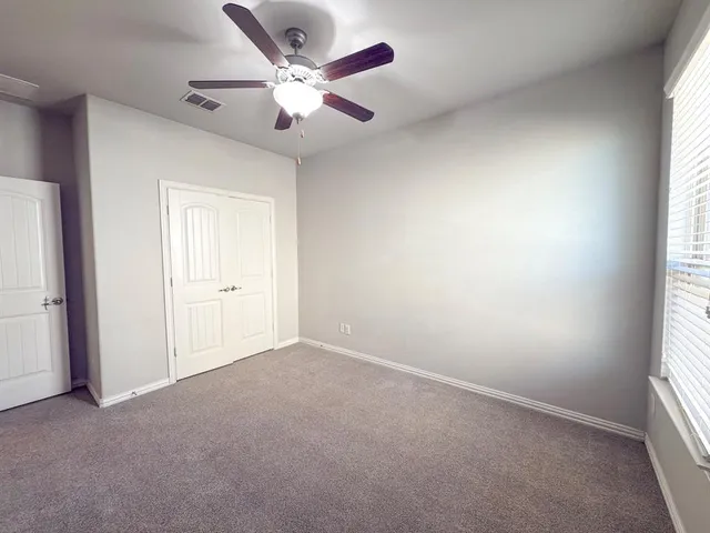 a bath tub sitting next to a white toilet and a sink