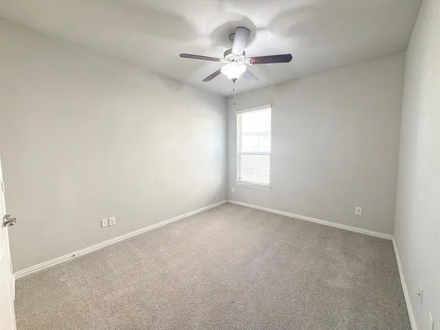 a view of room with wooden floor