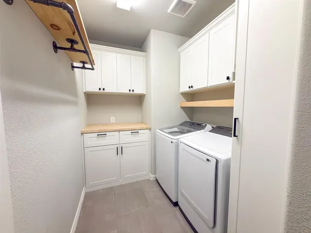 a view of a house with wooden floor and yard