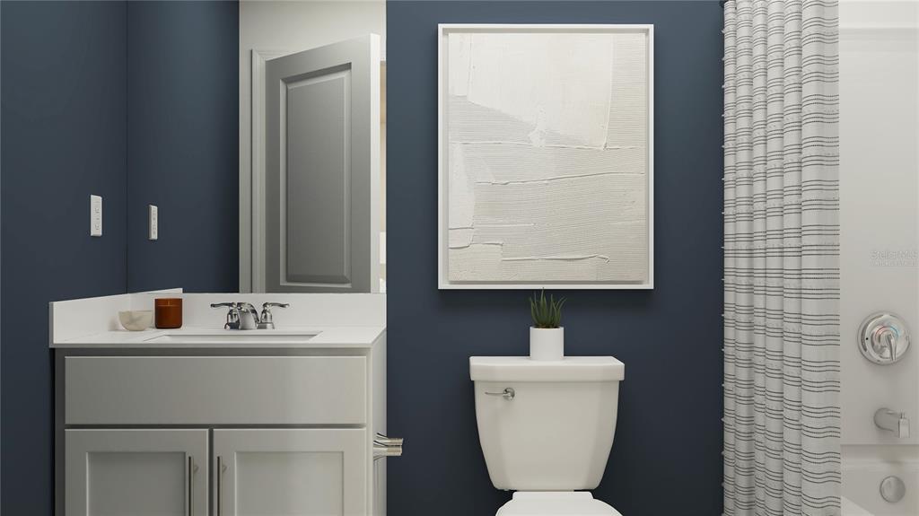 3087 Totem Road Eagle Lake, FL 33839 - Photo 8 of 25 a bathroom with a toilet sink and mirror