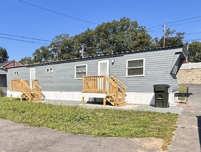 229 Miller Street, Unit B2 Ludlow, MA 01056 - Photo 2 of 22 a view of a house with a yard