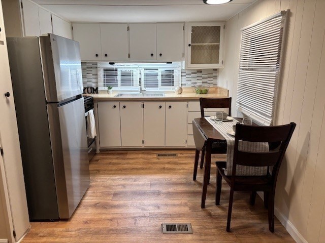 229 Miller Street, Unit B2 Ludlow, MA 01056 - Photo 8 of 22 a kitchen with stainless steel appliances granite countertop a refrigerator a stove a sink dishwasher and white cabinets with wooden floor