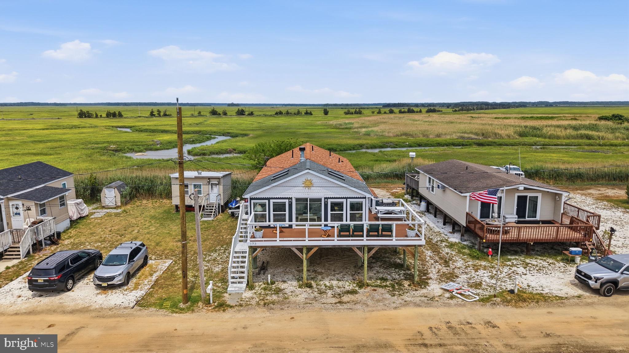 173 Cove Road Newport, NJ 08345 - Photo 50 of 72 a front view of a house with a ocean view