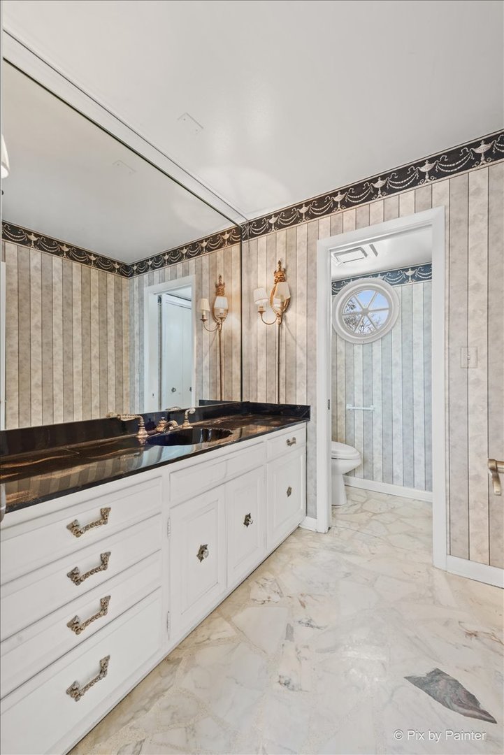 274 Timber View Drive Oak Brook, IL 60523 - Photo 19 of 68 a bathroom with a double vanity sink and a mirror