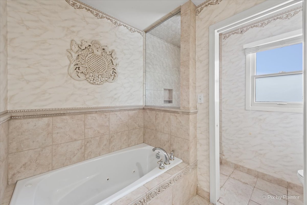 274 Timber View Drive Oak Brook, IL 60523 - Photo 37 of 68 a bathroom with a bathtub and shower