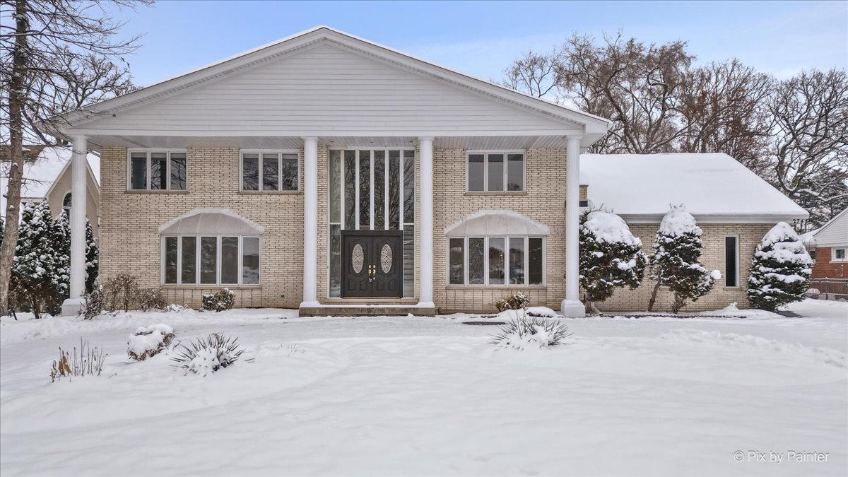 274 Timber View Drive Oak Brook, IL 60523 - Photo 68 of 68 a view of a house with a yard covered in snow