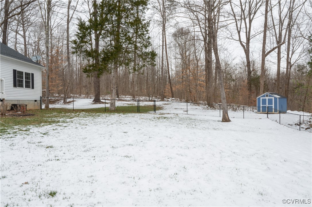 2750 Trenholm Road Powhatan, VA 23139 - Photo 30 of 42 Snowy yard featuring a shed