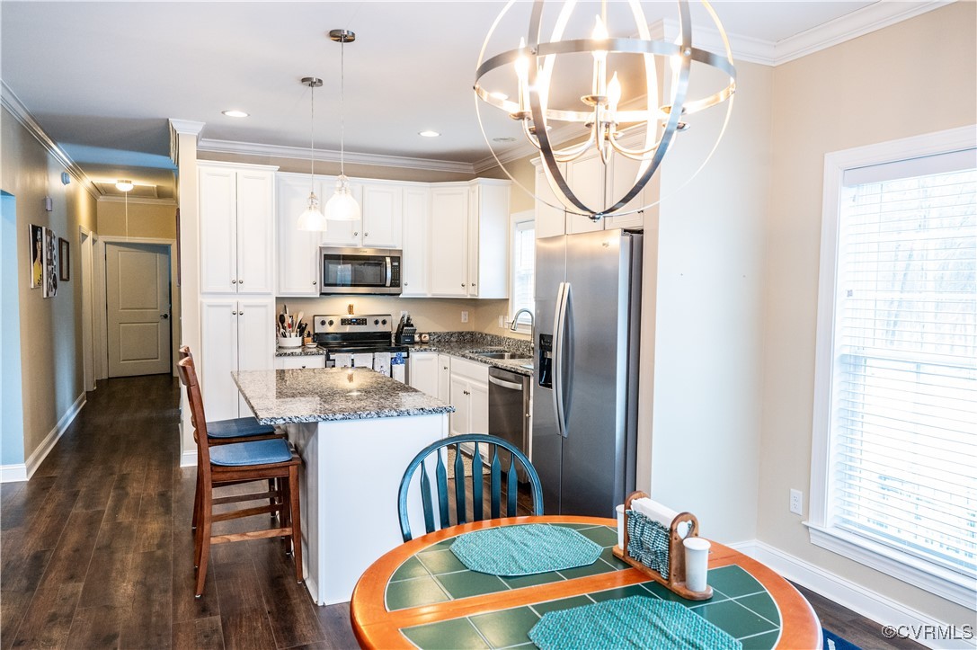 2750 Trenholm Road Powhatan, VA 23139 - Photo 7 of 42 Kitchen with white cabinetry, sink, a center islan