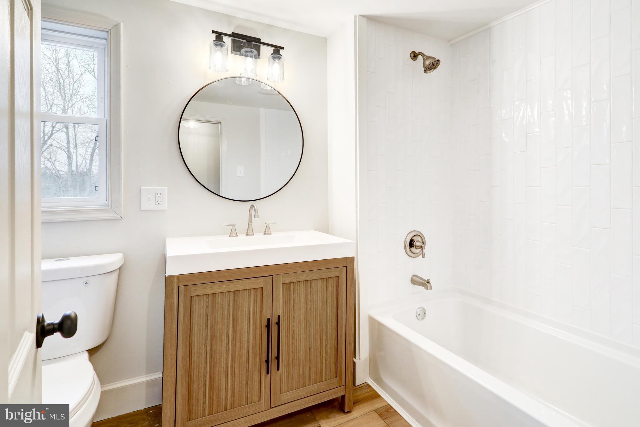 1965 Greenbriar Road York, PA 17404 - Photo 21 of 37 a bathroom with a sink a toilet and a bathtub