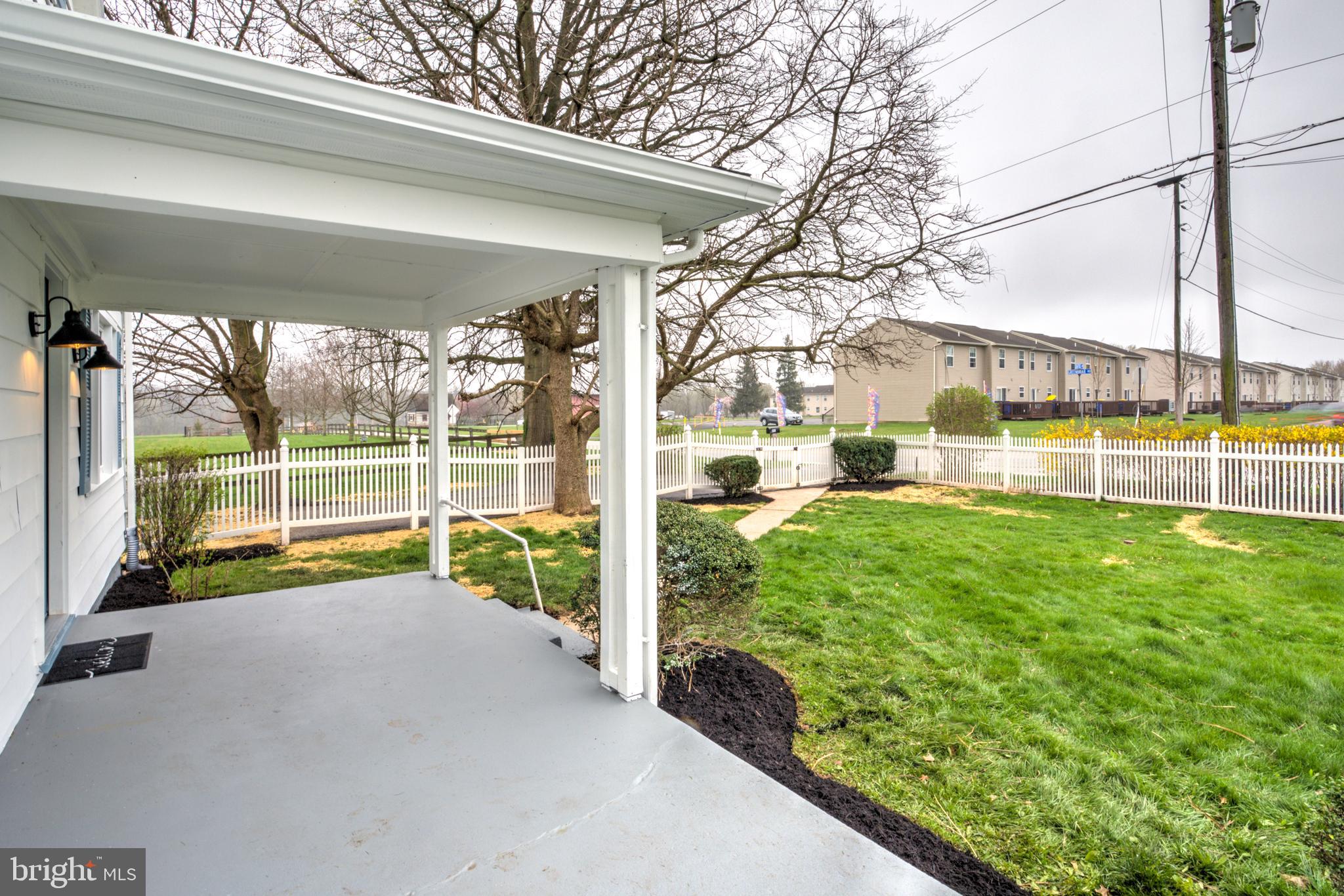 1965 Greenbriar Road York, PA 17404 - Photo 30 of 37 a view of swimming pool with a garden and lawn chairs