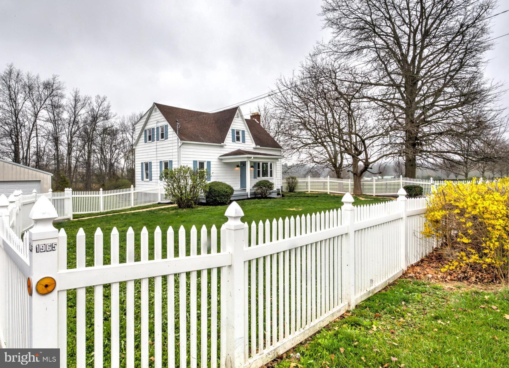 1965 Greenbriar Road York, PA 17404 - Photo 34 of 37 a view of a white house with a wooden fence