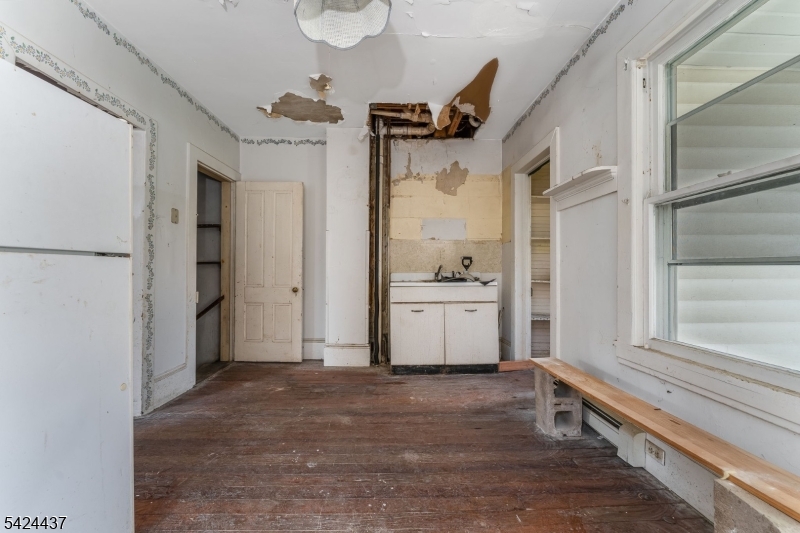 18 Center Street Annandale, NJ 08801 - Photo 5 of 26 a view of a storage & utility room with closet empty racks