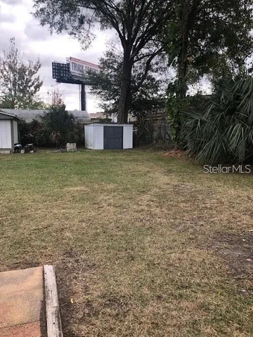 a backyard of a house with lots of green space