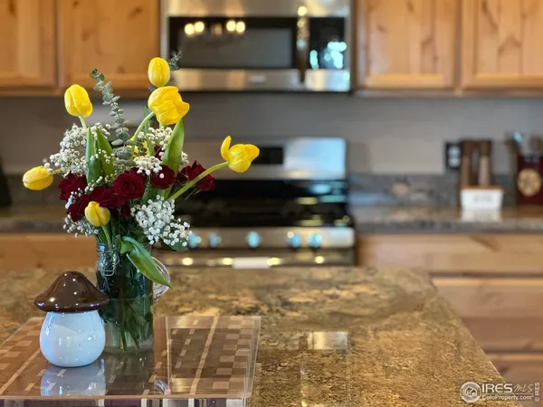 a kitchen with stainless steel appliances granite countertop a refrigerator sink and cabinets