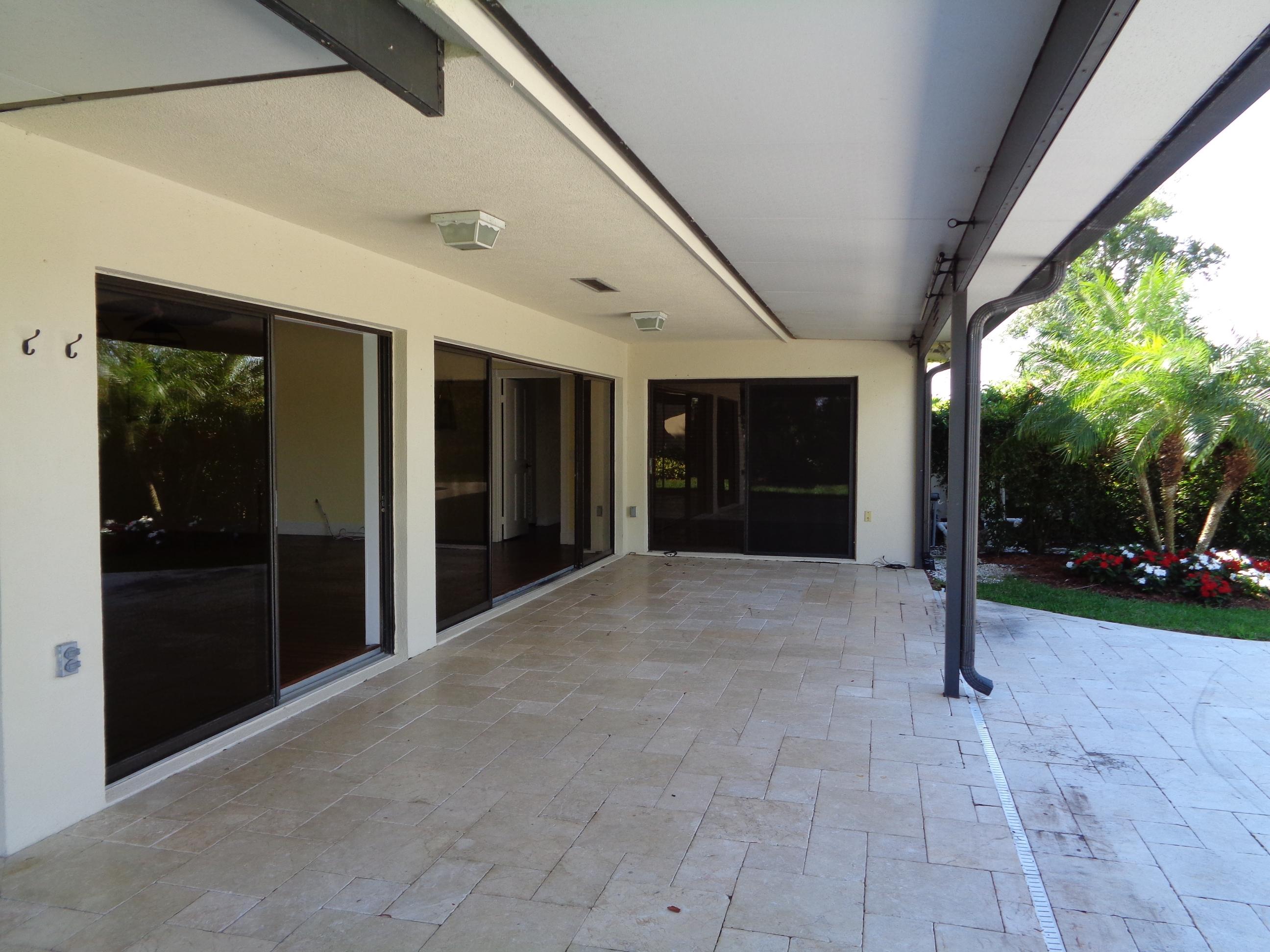 380 River Edge Road Jupiter, FL 33477 - Photo 10 of 38 Covered Patio Area