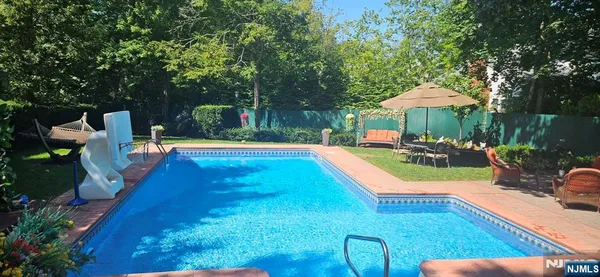 a view of a swimming pool with a patio