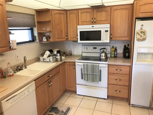 a kitchen with a sink and a stove