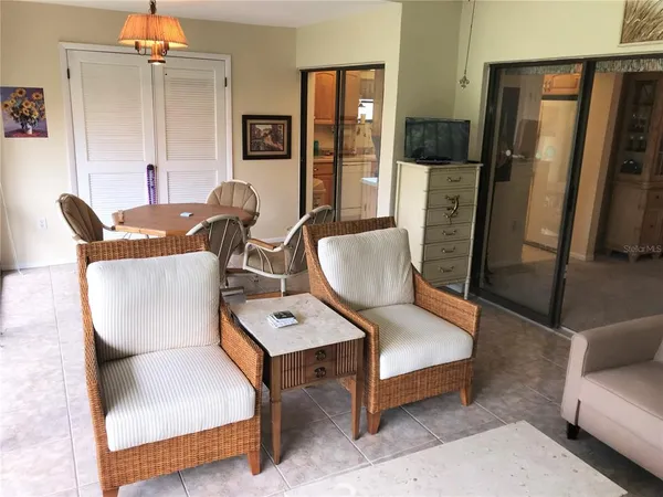 a living room with furniture rug and lamp
