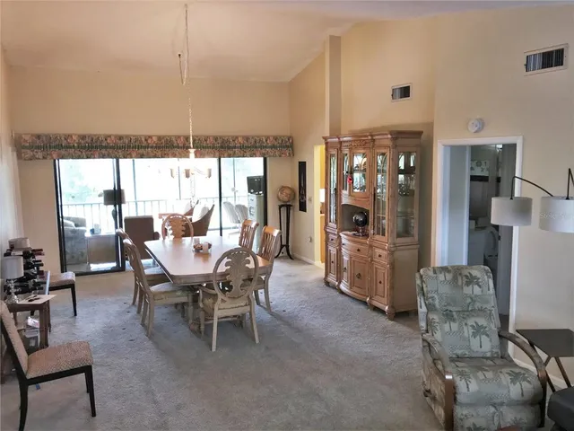 a dining room with furniture and window