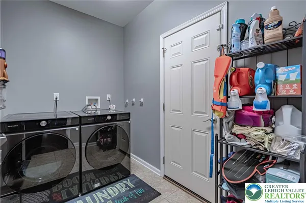 a bedroom with a large bed and a tv