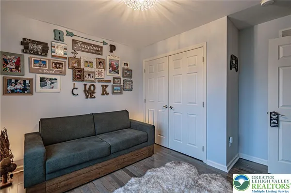 a view of living room with furniture and wooden floor