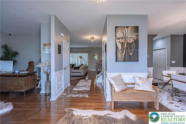 a living room with furniture and a painting
