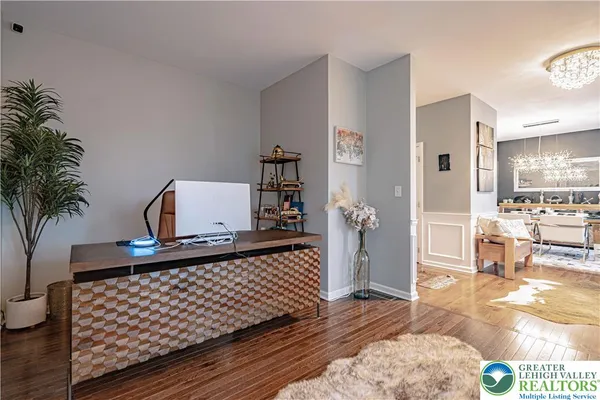 a kitchen with stainless steel appliances granite countertop a stove and a wooden floors