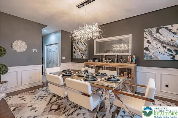 a kitchen with stainless steel appliances granite countertop a refrigerator a stove top oven a sink and dishwasher
