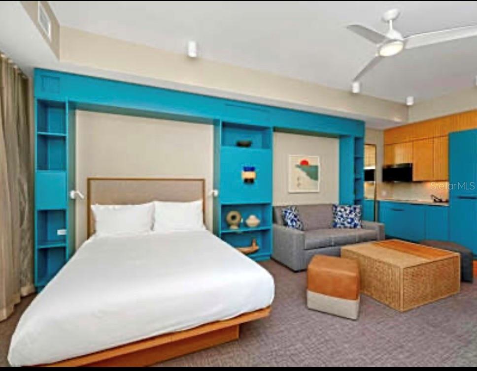 3151 Sunset Walk Drive, Unit 411 Kissimmee, FL 34747 - Photo 11 of 23 a bedroom with a bed window and couch