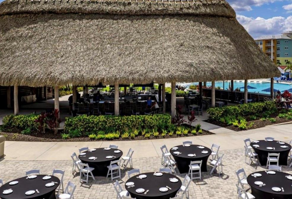 3151 Sunset Walk Drive, Unit 411 Kissimmee, FL 34747 - Photo 17 of 23 a couple of table and chairs in the patio