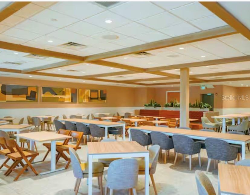 3151 Sunset Walk Drive, Unit 411 Kissimmee, FL 34747 - Photo 19 of 23 wooden view of a dining room with furniture and wooden floor