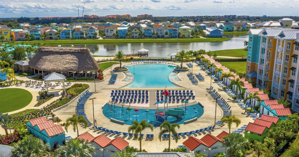 3151 Sunset Walk Drive, Unit 411 Kissimmee, FL 34747 - Photo 2 of 23 an aerial view of a house with a garden and lake view