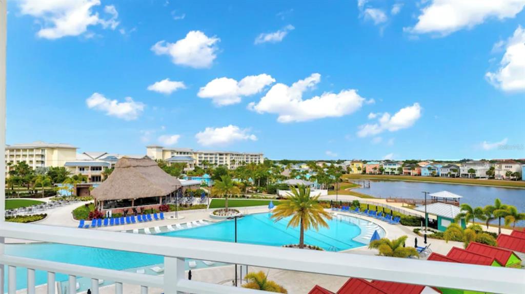 3151 Sunset Walk Drive, Unit 411 Kissimmee, FL 34747 - Photo 5 of 23 a view of a swimming pool and an outdoor seating