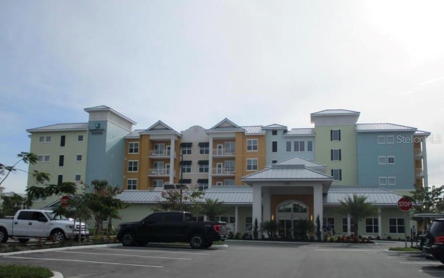 3151 Sunset Walk Drive, Unit 411 Kissimmee, FL 34747 - Photo 8 of 23 a front view of a building with street view