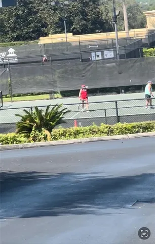 a view of a street with a cars parked on road