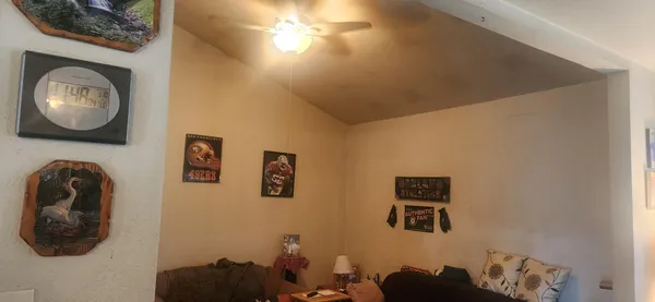 a view of livingroom with furniture and a chandelier