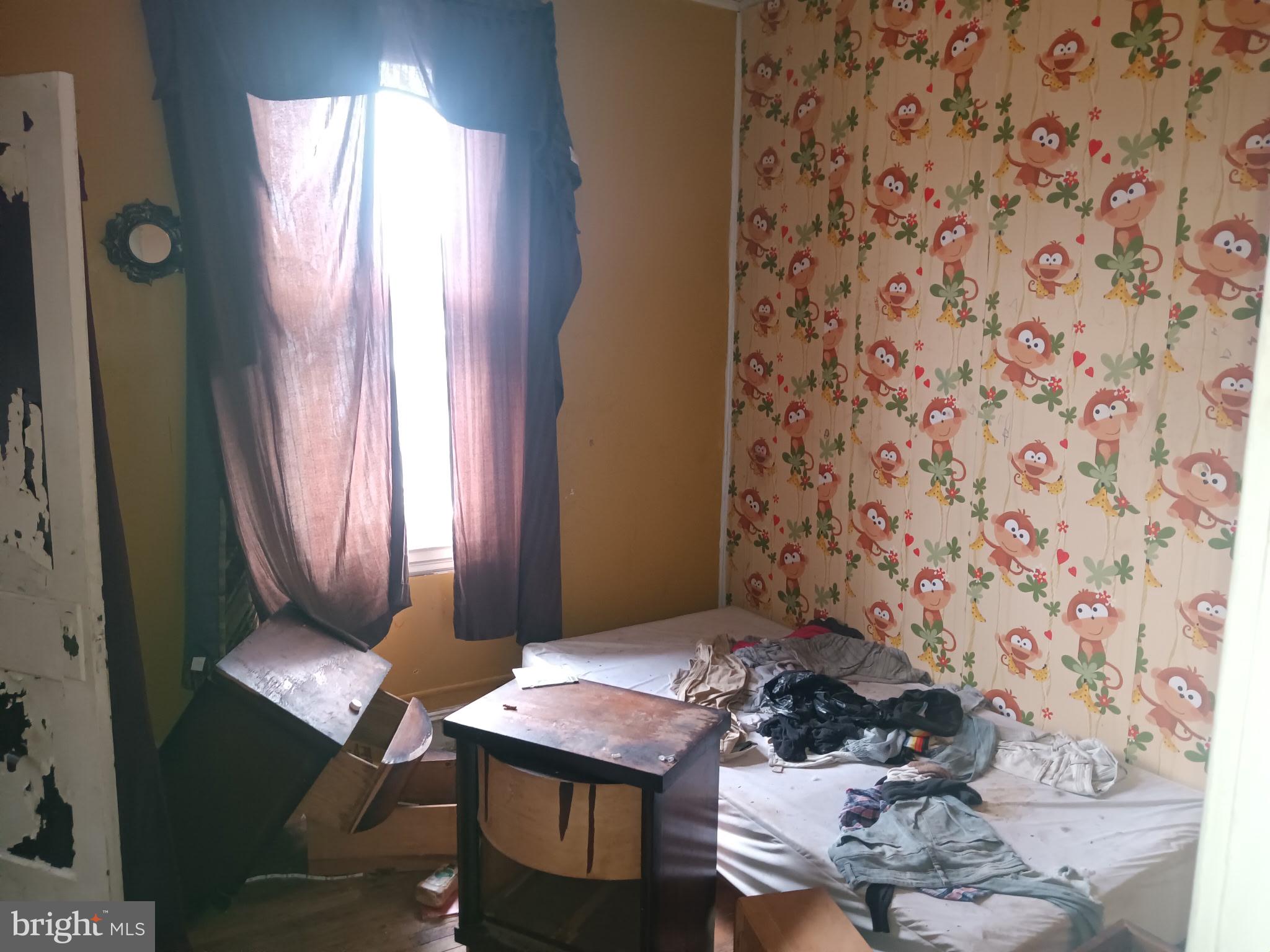 2908 Baker Street Baltimore, MD 21216 - Photo 11 of 15 a workspace with furniture and window